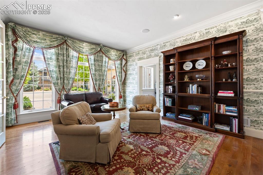 Image 16 of 49: A private wing offers retreat: a darling study with direct access to the pr