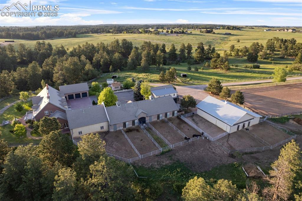 Image 36 of 49: Rear view of the barn showing the paddocks.