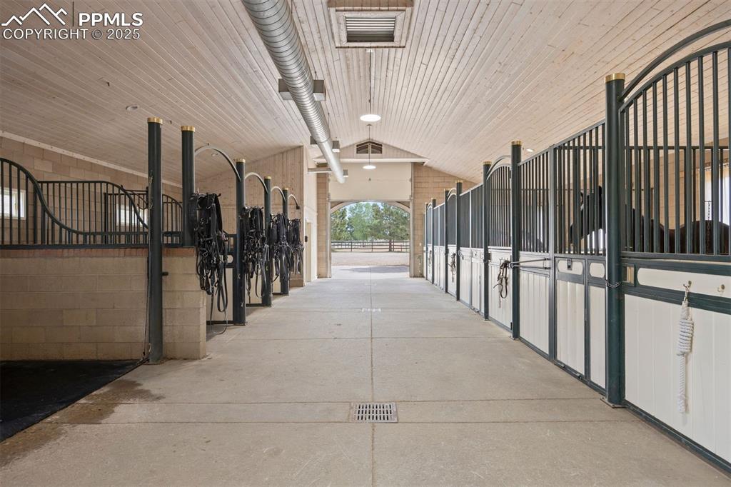 Image 4 of 49: This is a working horse property through and through—yet your horses live w