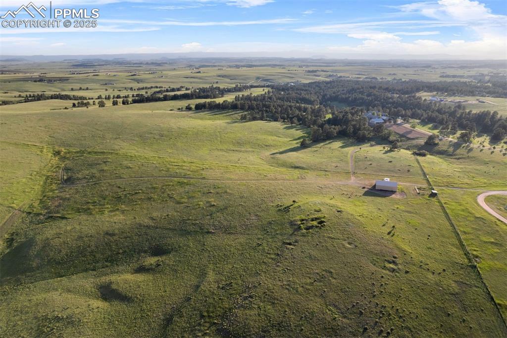 Image 46 of 49: West-facing view of the entire property - the property comprises of two par