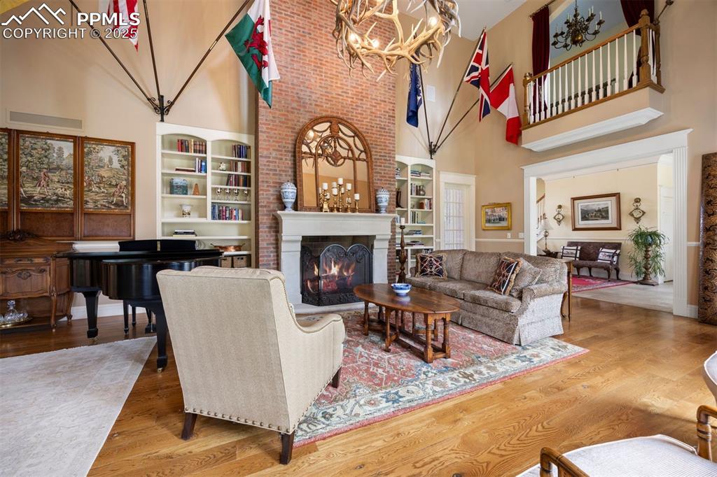 Image 8 of 49: Walls of windows overlook the gardens and dormer windows add natural light 