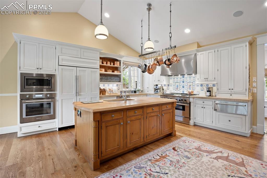 Image 9 of 49: Heritage and function meet in the kitchen, centered around a butcher block 
