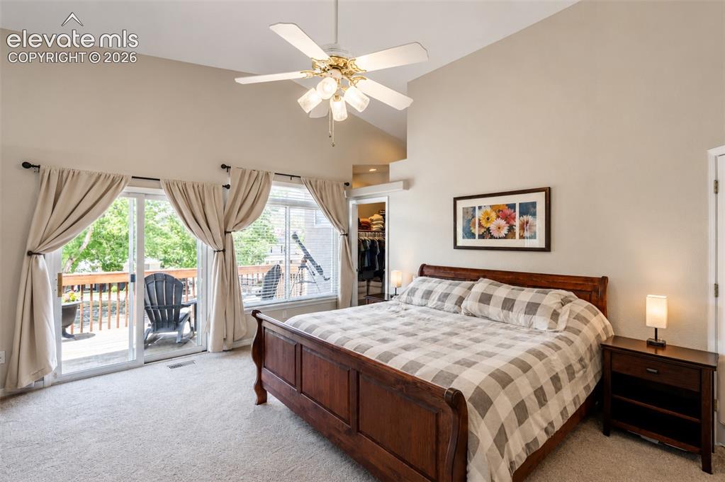 Image 10 of 50: Primary bedroom (1) with walk in closet, walk out balcony deck, and ensuite