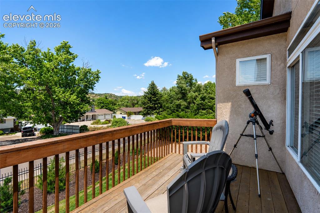 Image 11 of 50: Wood balcony off primary bedroom (1) - main floor