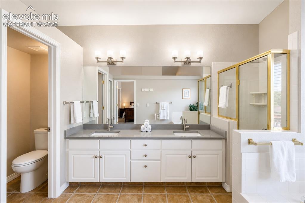 Image 11 of 50: Primary bathroom (1) five piece bath - main floor