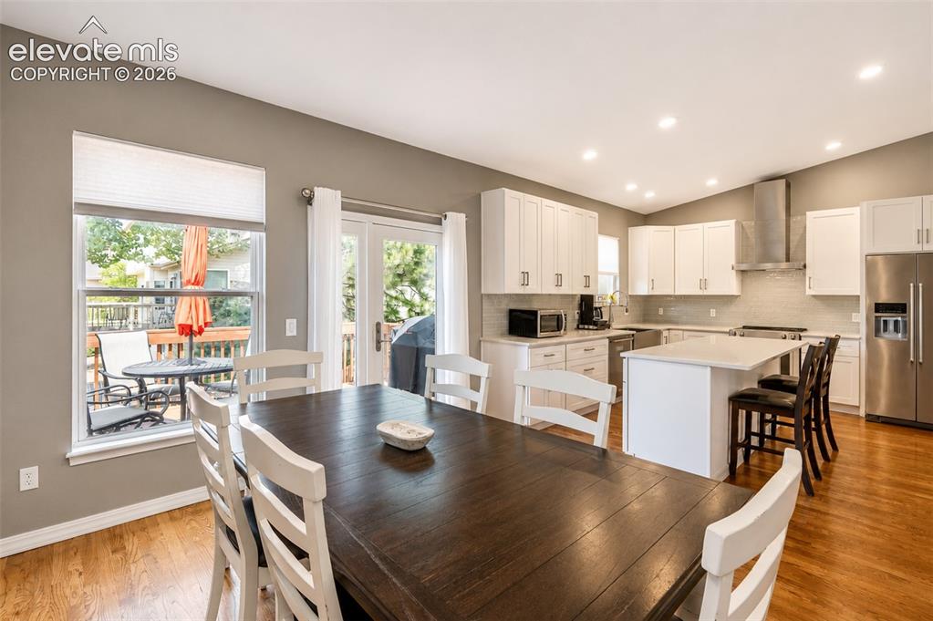 Image 18 of 50: Dining area with walk out deck/kitchen - main floor