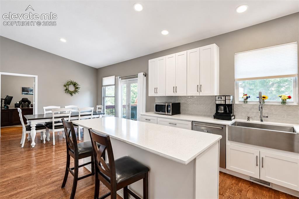 Image 22 of 50: Kitchen with pantry/dining area with walk out - main floor
