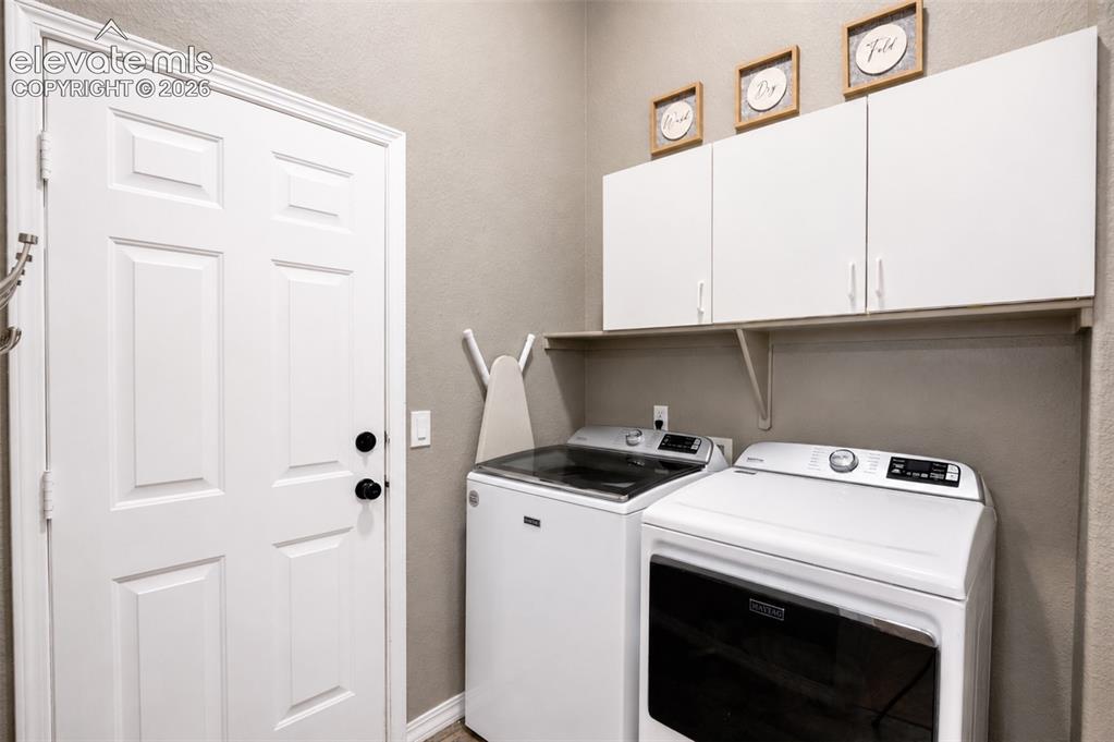 Image 24 of 50: Laundry/mud room off garage entrance - main floor