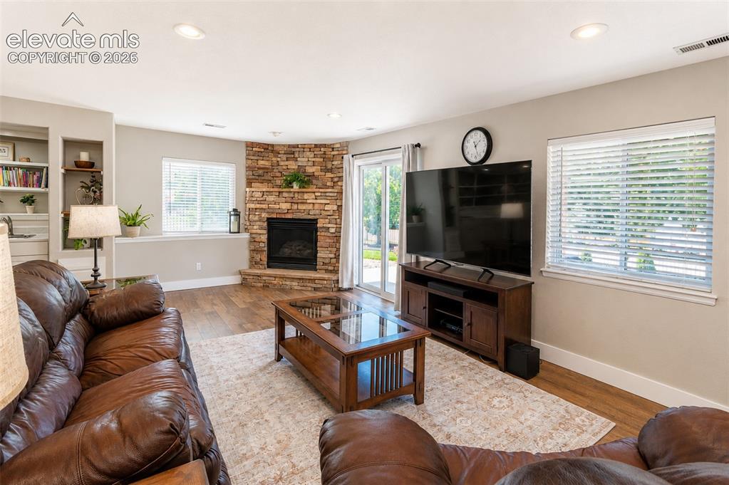 Image 25 of 50: Second living room with fireplace and walk out - basement
