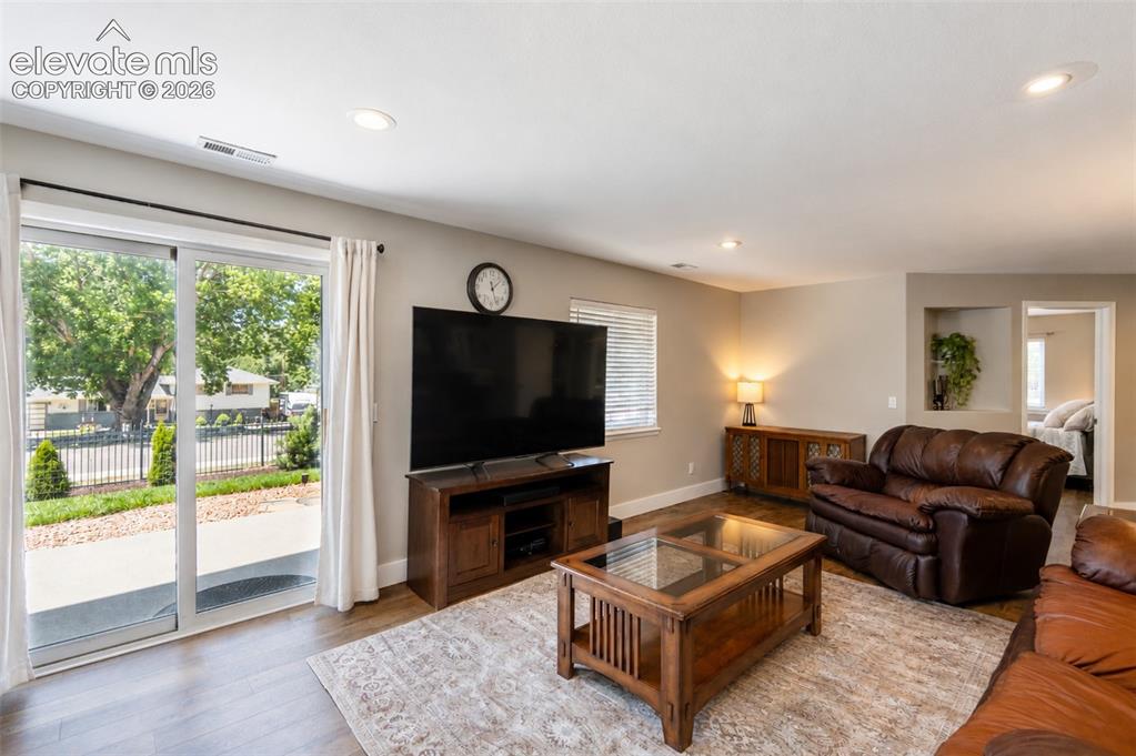 Image 26 of 50: Second living room with fireplace and walk out - basement
