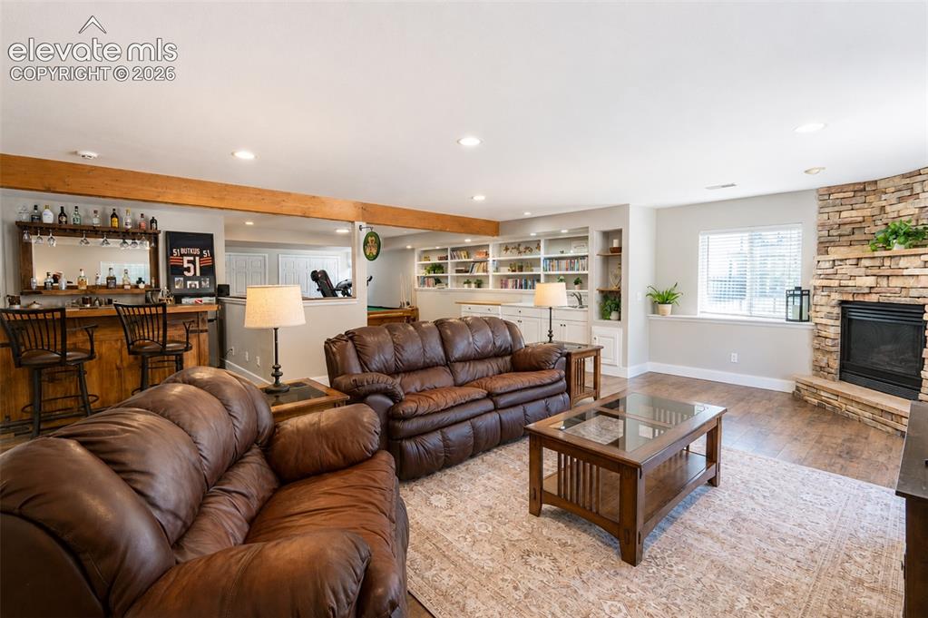 Image 28 of 50: Second living room with fireplace and walk out - basement