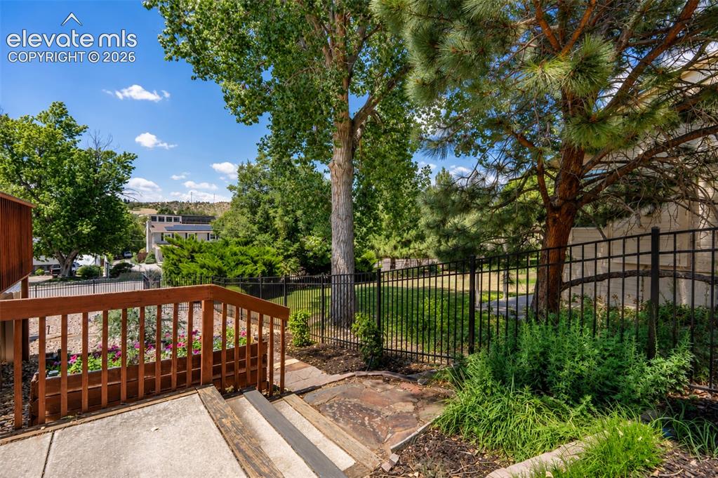 Image 41 of 50: Side yard off kitchen walk out