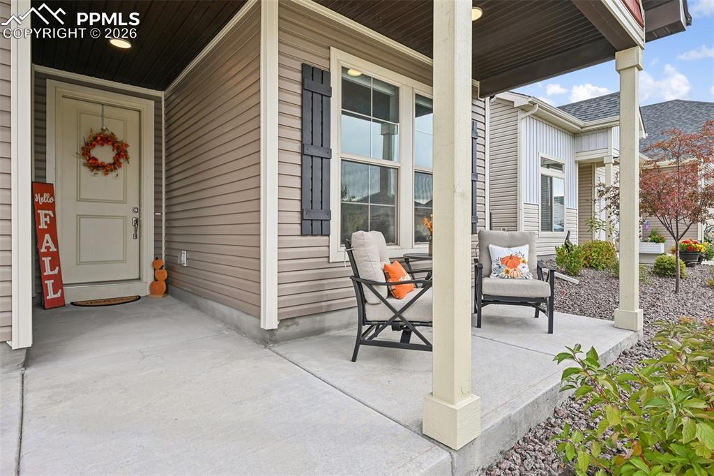 Image 4 of 32: Welcoming covered front porch.