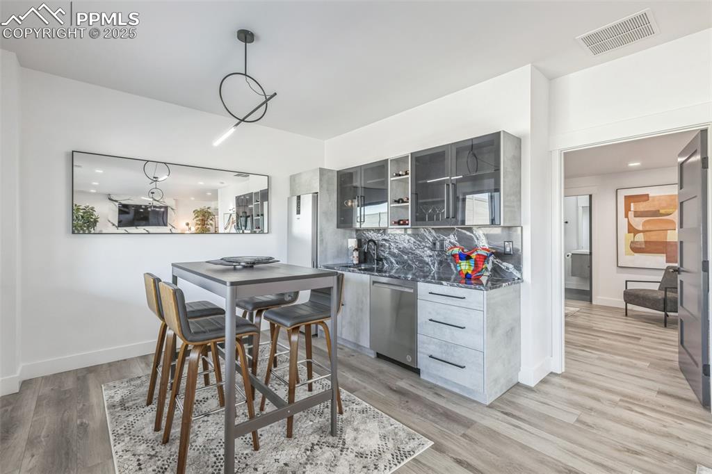Image 19 of 50: Kitchen featuring recessed lighting, stainless steel dishwasher, modern cab