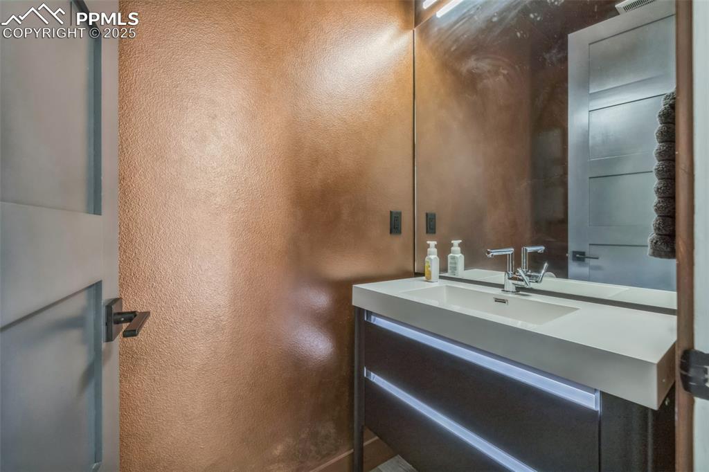 Image 28 of 50: Bathroom featuring vanity