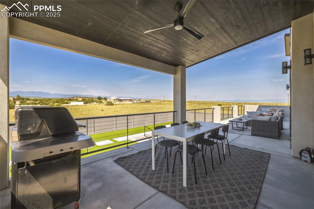 Image 34 of 50: View of patio / terrace with a grill, a ceiling fan, and outdoor dining spa