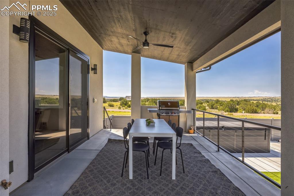 Image 35 of 50: Balcony featuring a ceiling fan