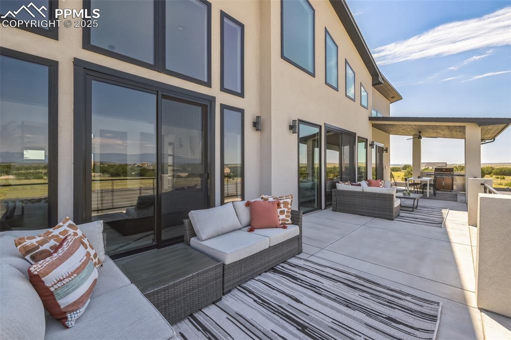 Image 37 of 50: View of patio / terrace featuring an outdoor hangout area and an outdoor ki