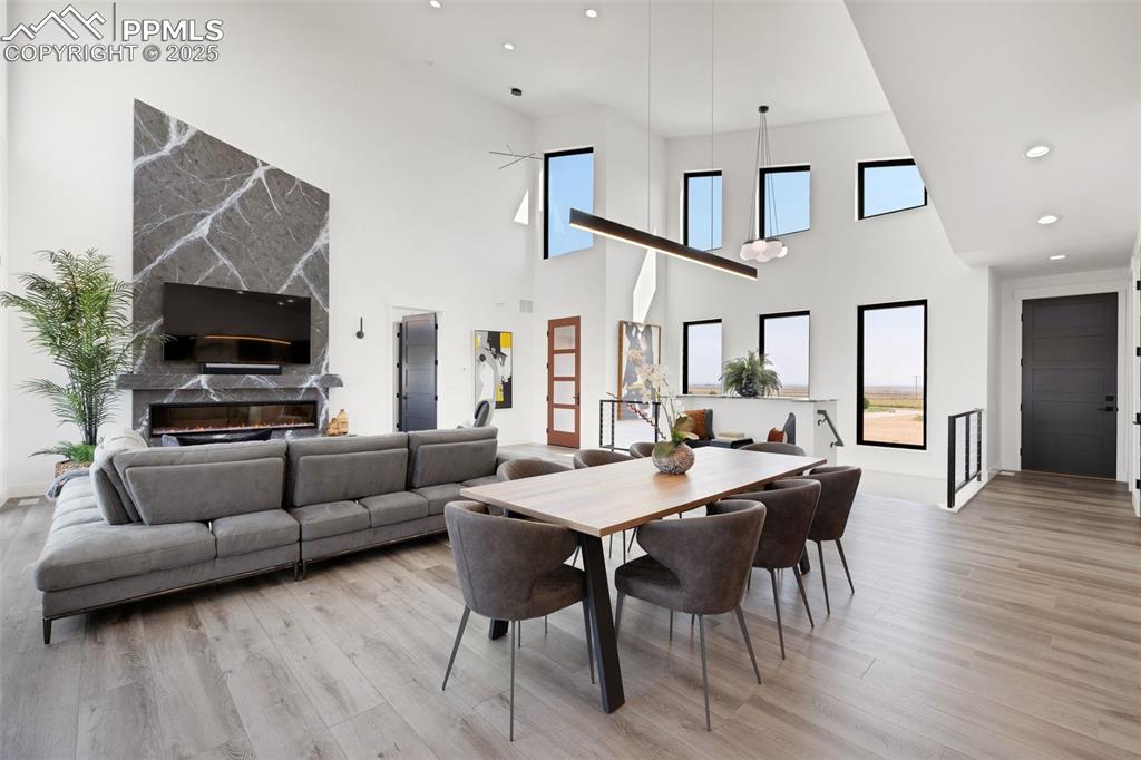 Image 9 of 50: Dining space featuring light wood-style flooring, recessed lighting, and a