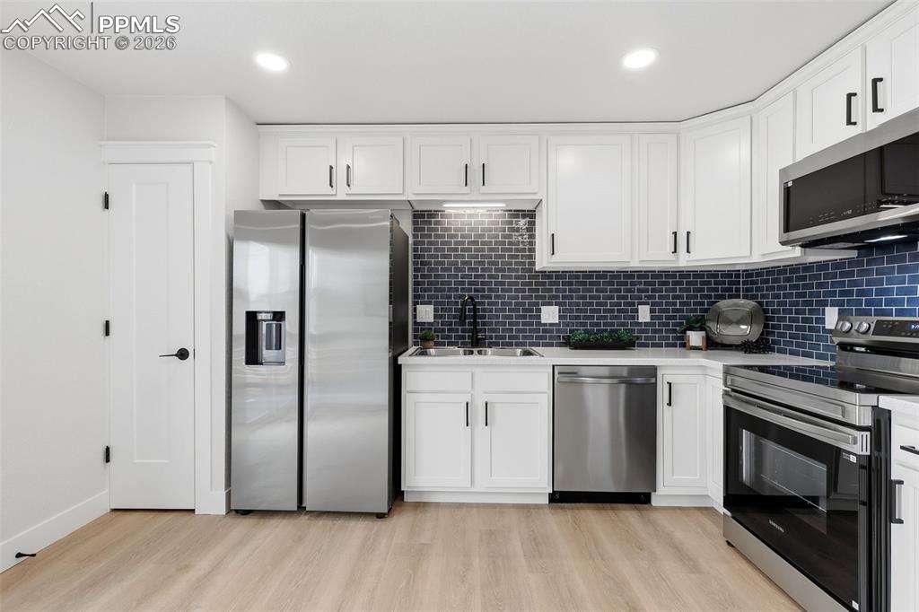 Image 10 of 32: Updated Kitchen with Stainless Appliances