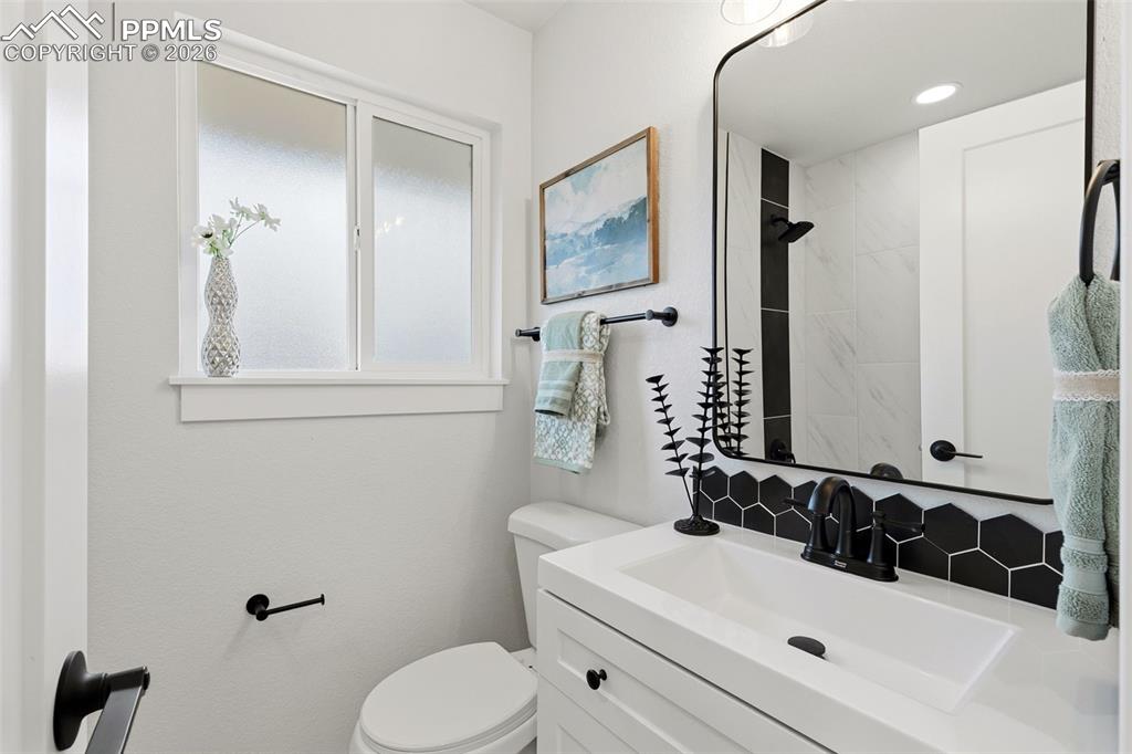 Image 16 of 32: Updated Bathroom with Designer Tile