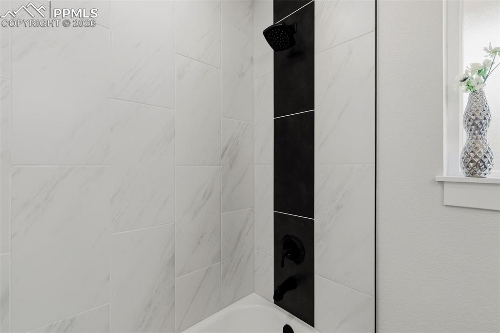 Image 17 of 32: Stylish Tile in Upgraded Bathroom