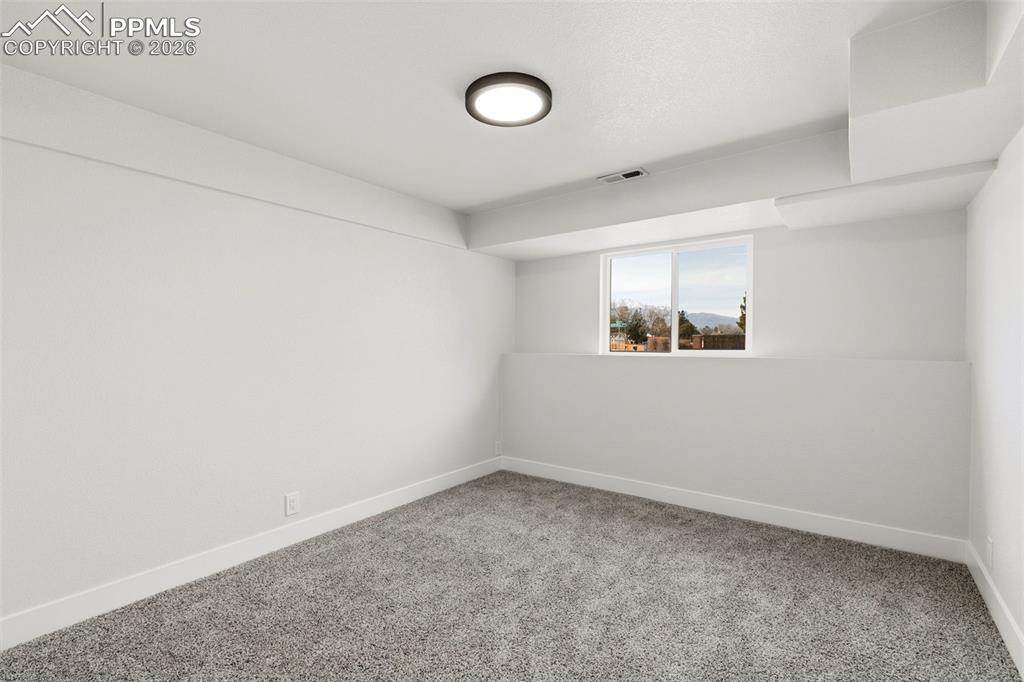 Image 21 of 32: Lower Level Bedroom with Natural Light