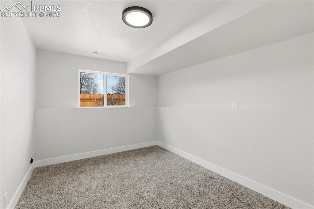 Image 25 of 32: Lower Level Bedroom with Natural Light