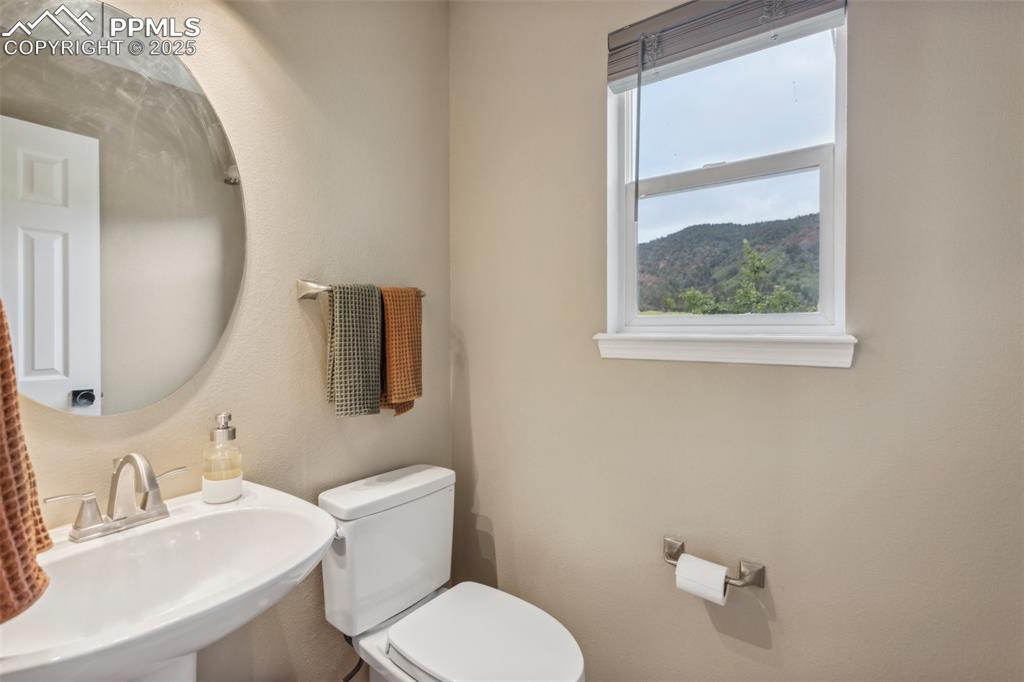 Image 15 of 37: Main level half bathroom