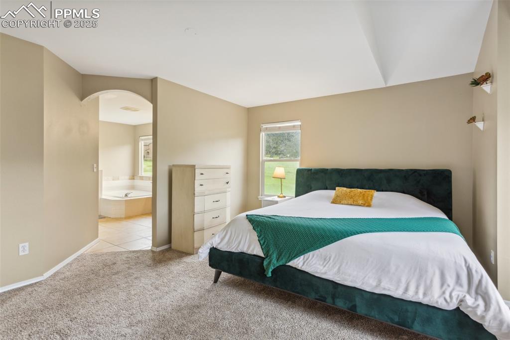 Image 16 of 37: Primary suite, 1 of 4 upper level bedrooms
