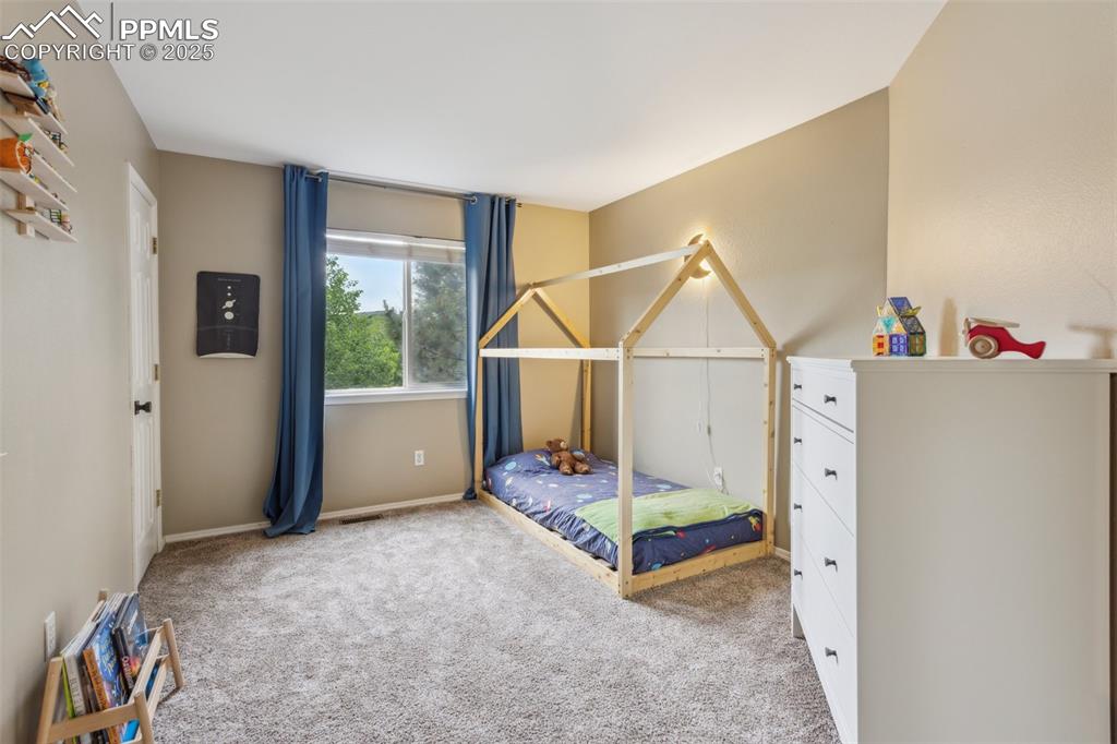 Image 19 of 37: 1 of 4 upper level bedrooms