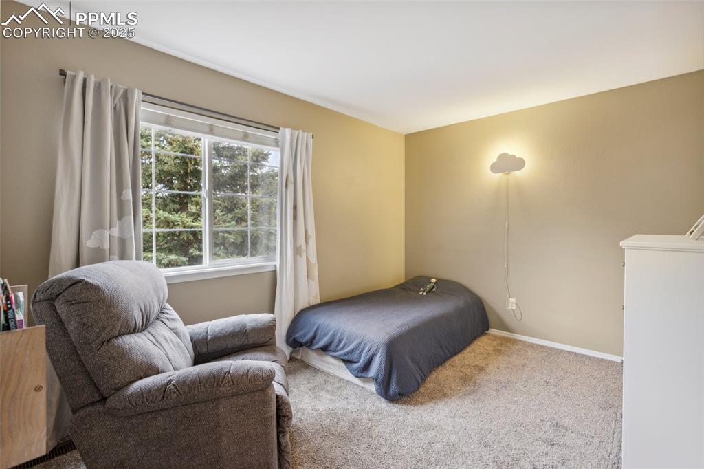 Image 22 of 37: 1 of 4 upper level bedrooms