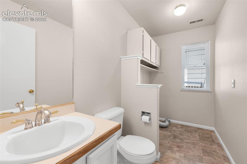 Image 17 of 44: 1/2 bath / laundry room combo