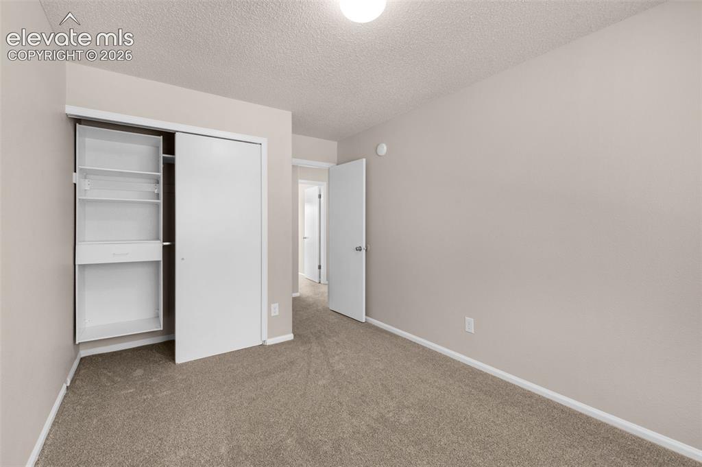 Image 26 of 44: bedroom w/ new carpet and paint