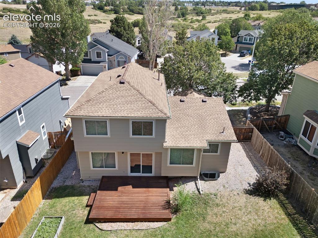 Image 35 of 44: Back of home w/ large deck