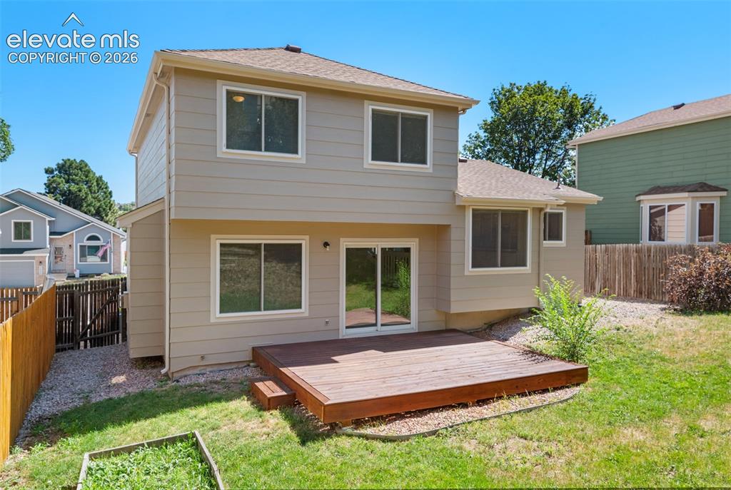 Image 38 of 44: Fenced yard and deck