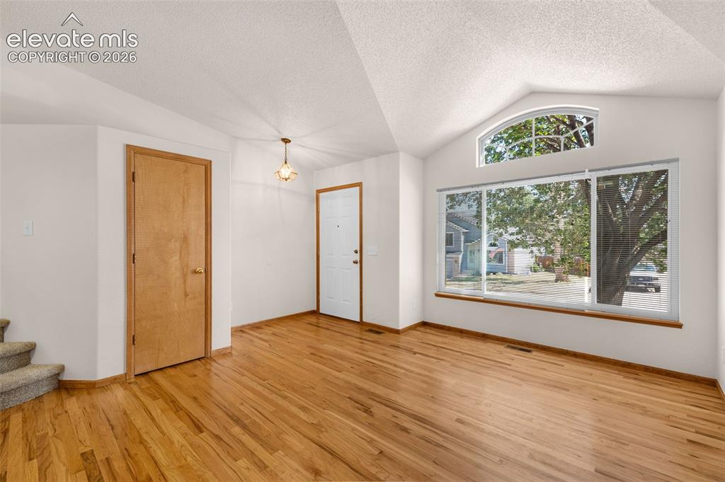 Image 4 of 44: Living room with wood floors