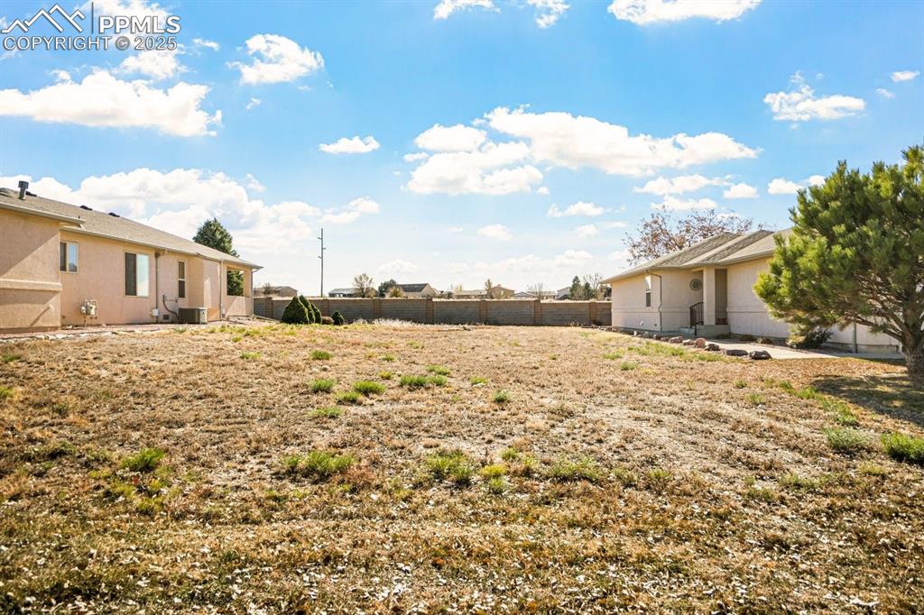 Image 10 of 11: View of yard with a patio area