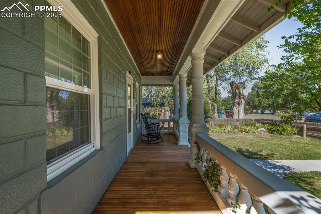 Image 3 of 19: Porch with a lawn
