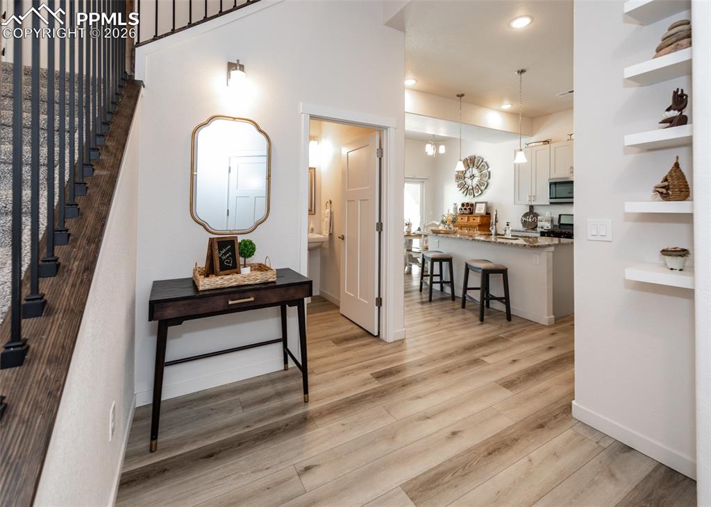 Image 7 of 49: Foyer featuring light wood-style flooring and recessed lighting