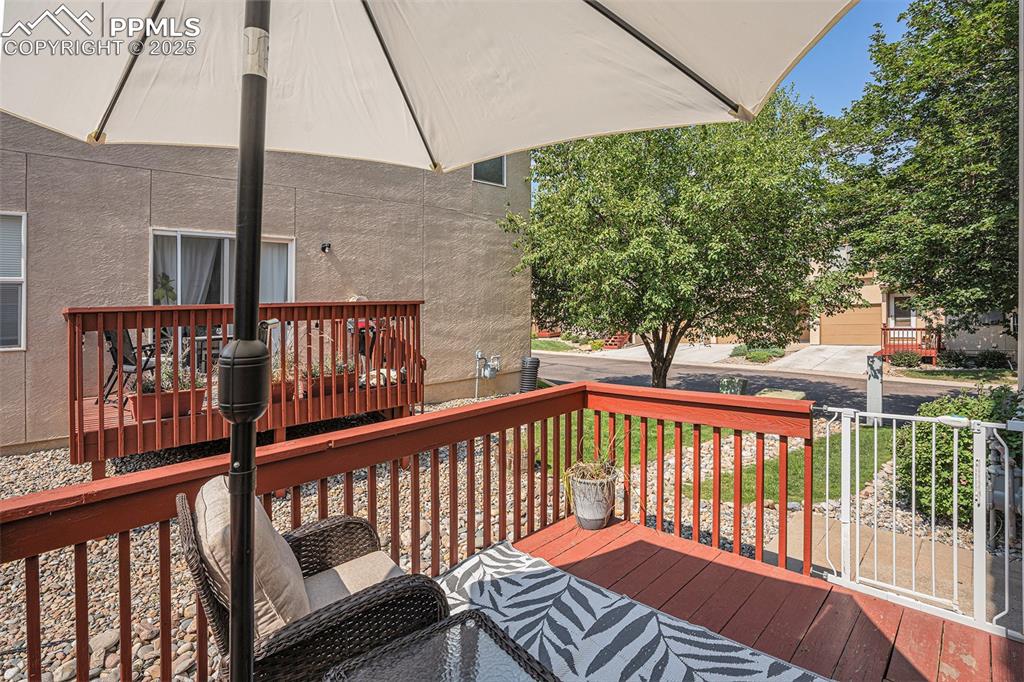 Image 11 of 22: Lovely wooded deck to enjoy the wildlife and the amazing Colorado weather