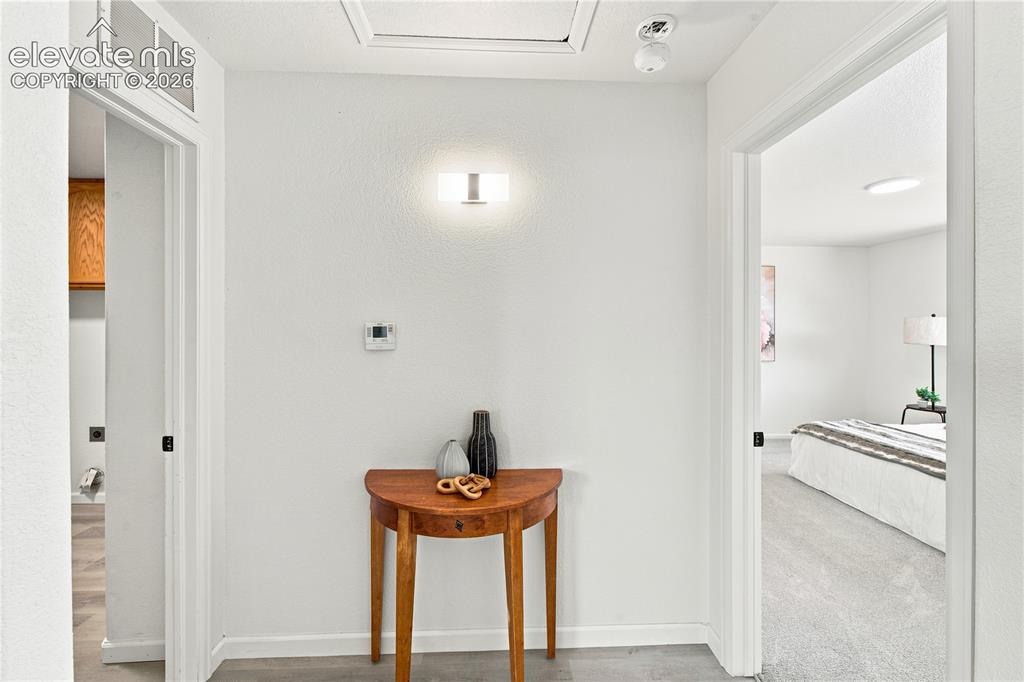 Image 19 of 40: White interior walls with light gray flooring