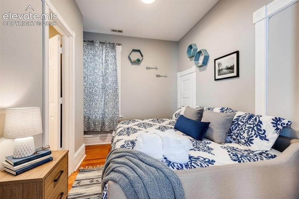 Image 14 of 27: Second bedroom on main floor, could also flex as an office, playroom, loung