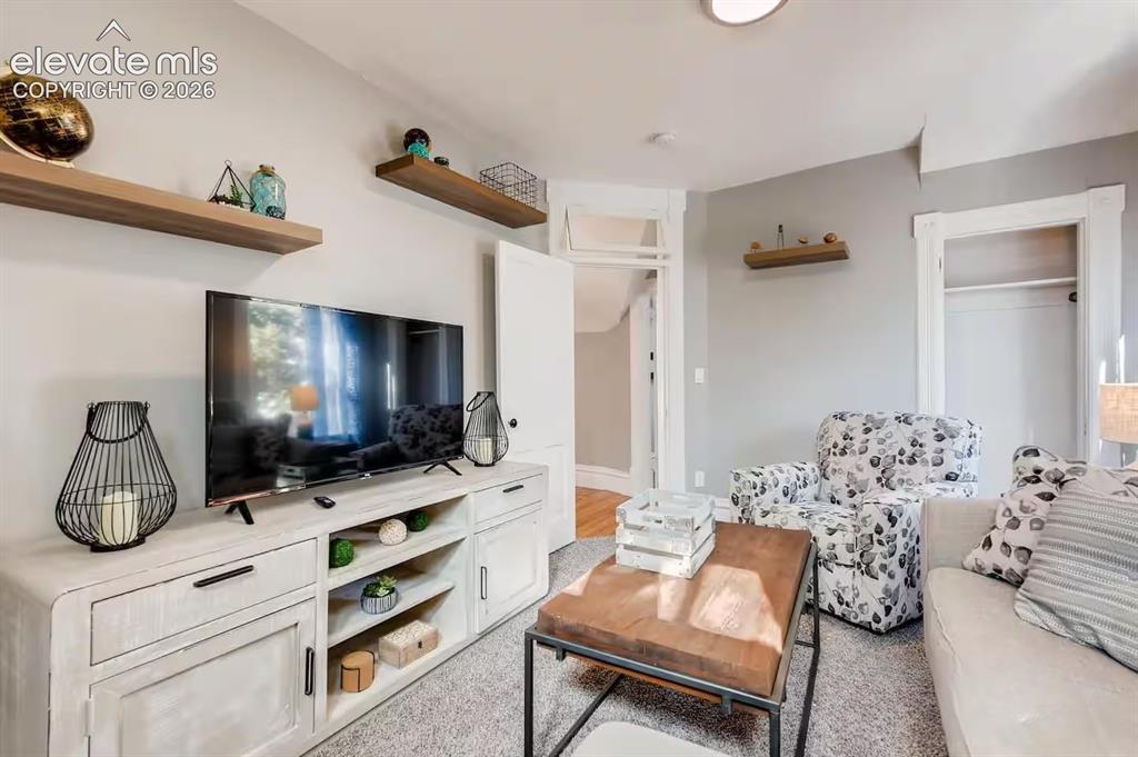 Image 16 of 27: Second floor living room could also be a 5th bedroom with closet and window