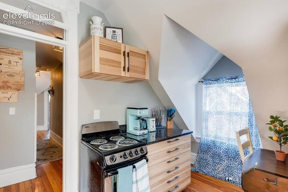 Image 23 of 27: Kitchen shows much of the old victorian character with dormer windows and s