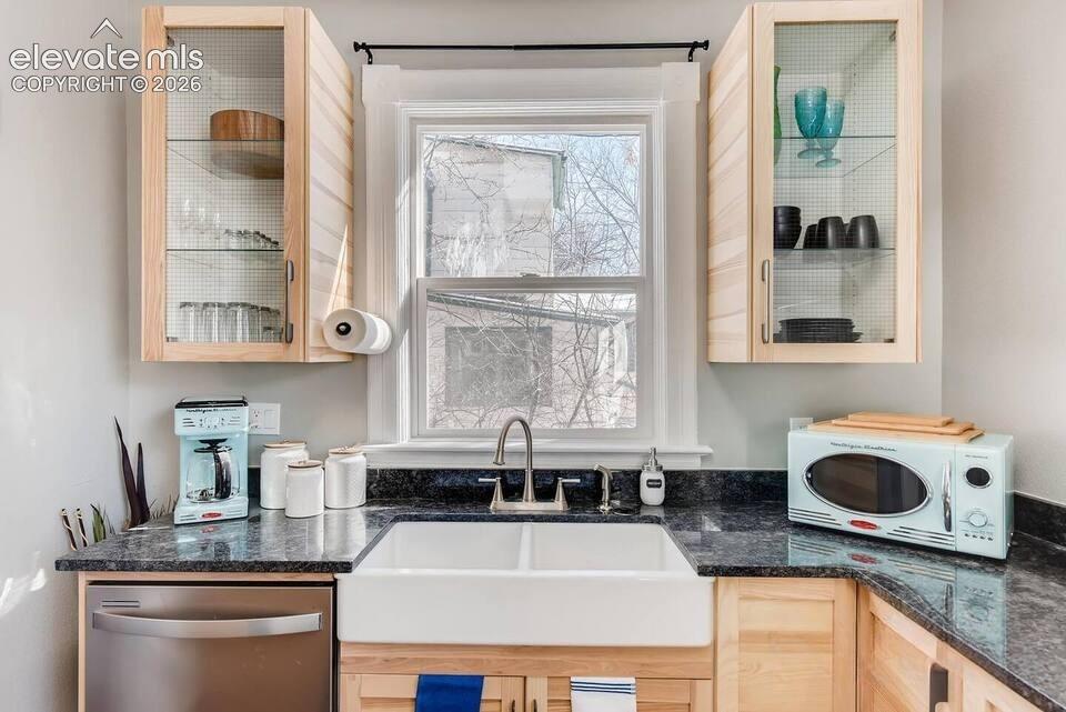 Image 6 of 27: Modern cabinetry is the perfect accent against the old-world charm and arch