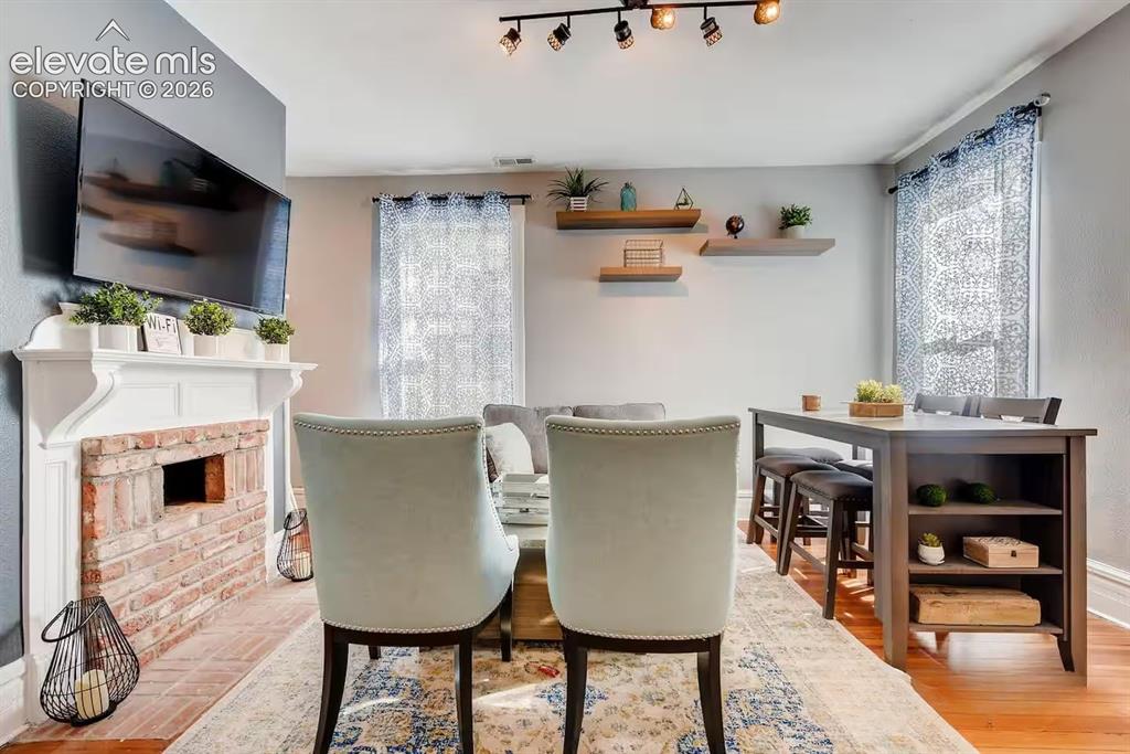 Image 9 of 27: Fireplace may not be functional currently, but still brings style and charm