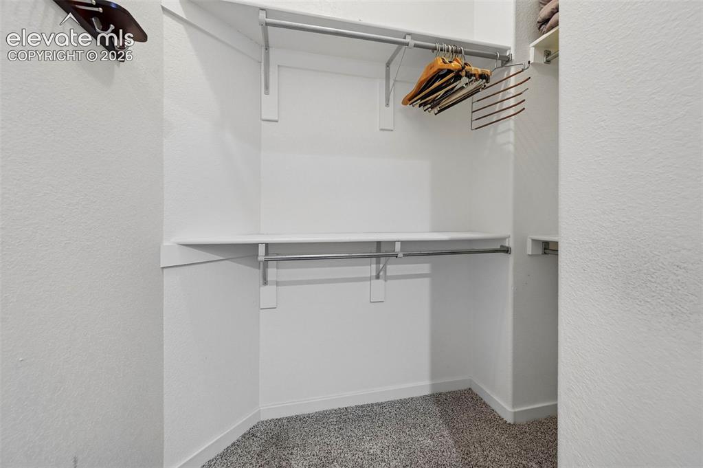 Image 10 of 28: Primary Bedroom Walk-in