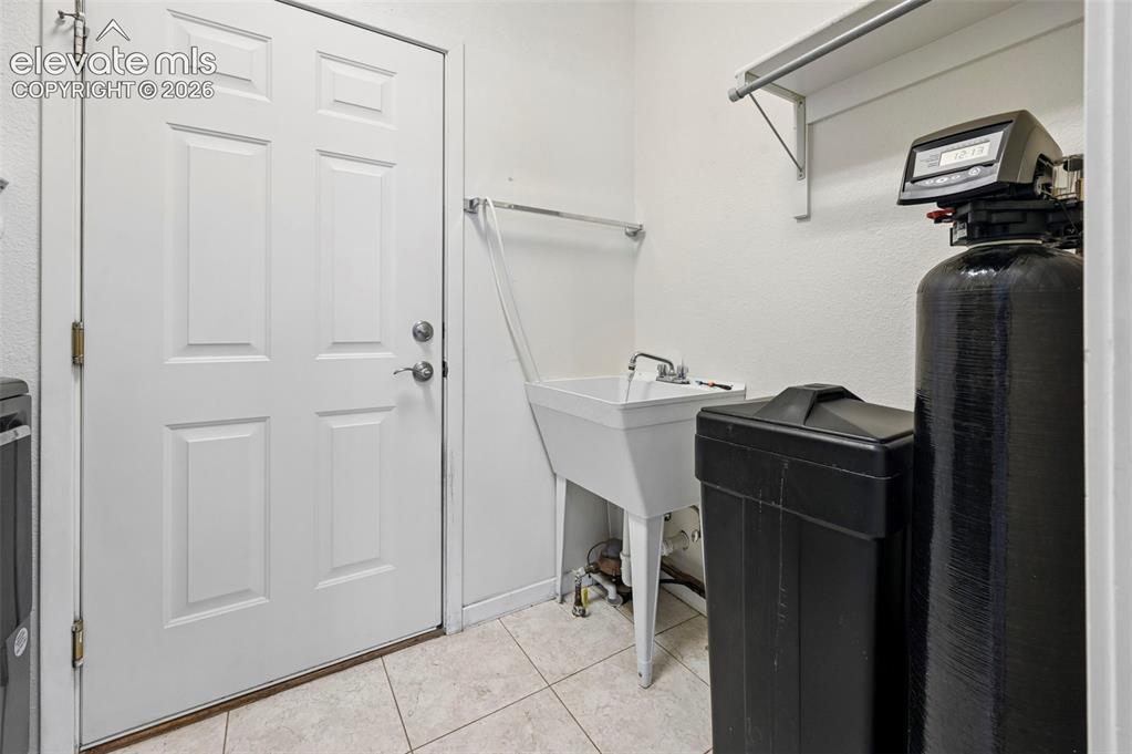 Image 23 of 28: Water-Softener owned and Included