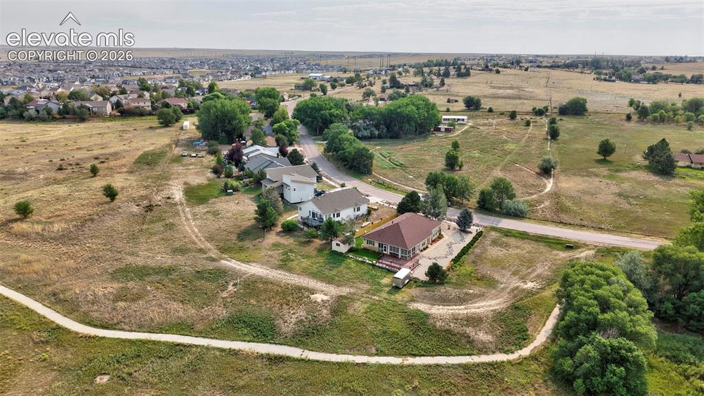 Image 3 of 28: Vacant area next to home is part of this sale.